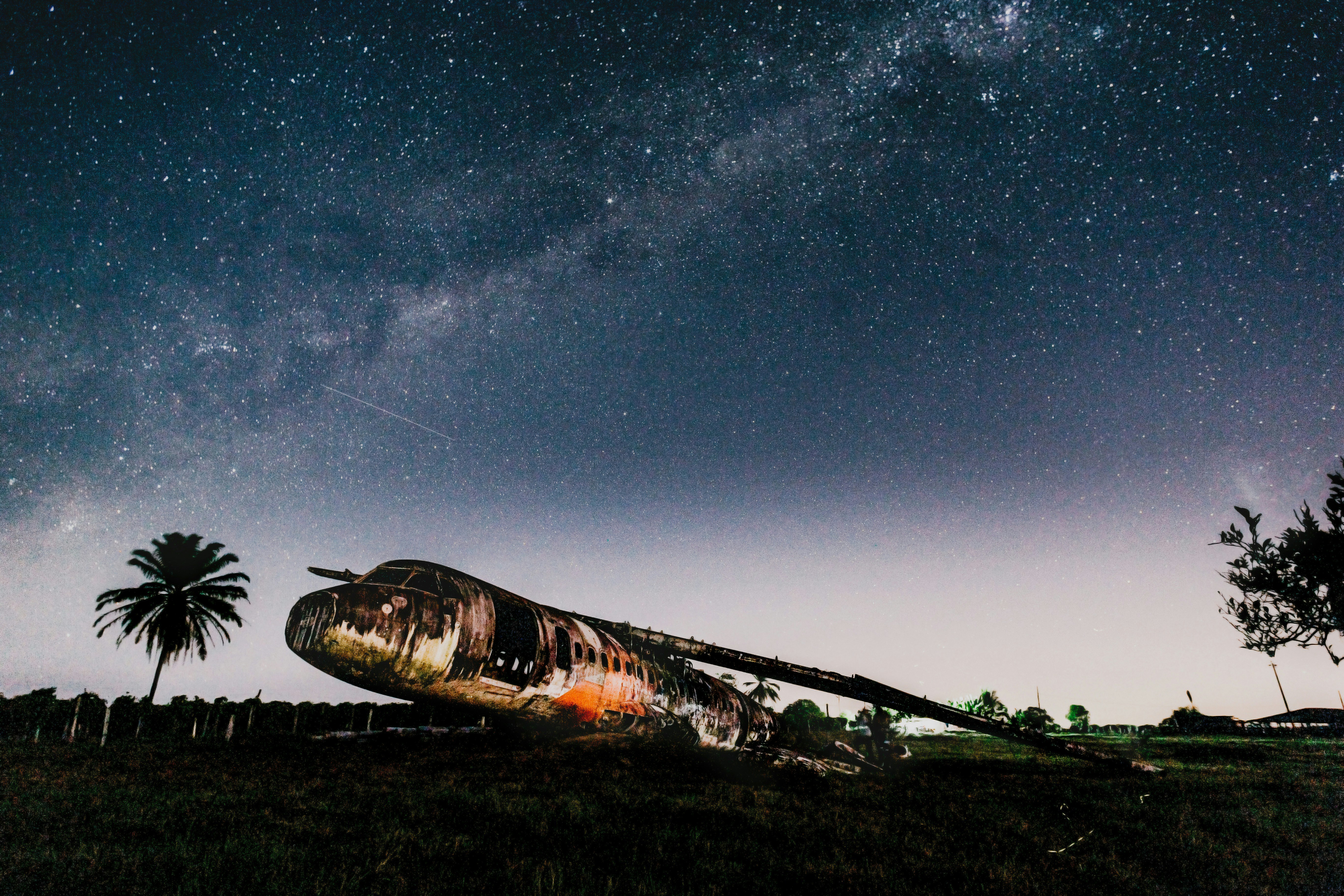 Abandoned Plane Wreck Under Starry Sky