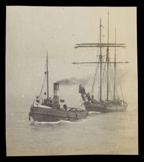 Tugboat Towing Sailing Ship on Sea