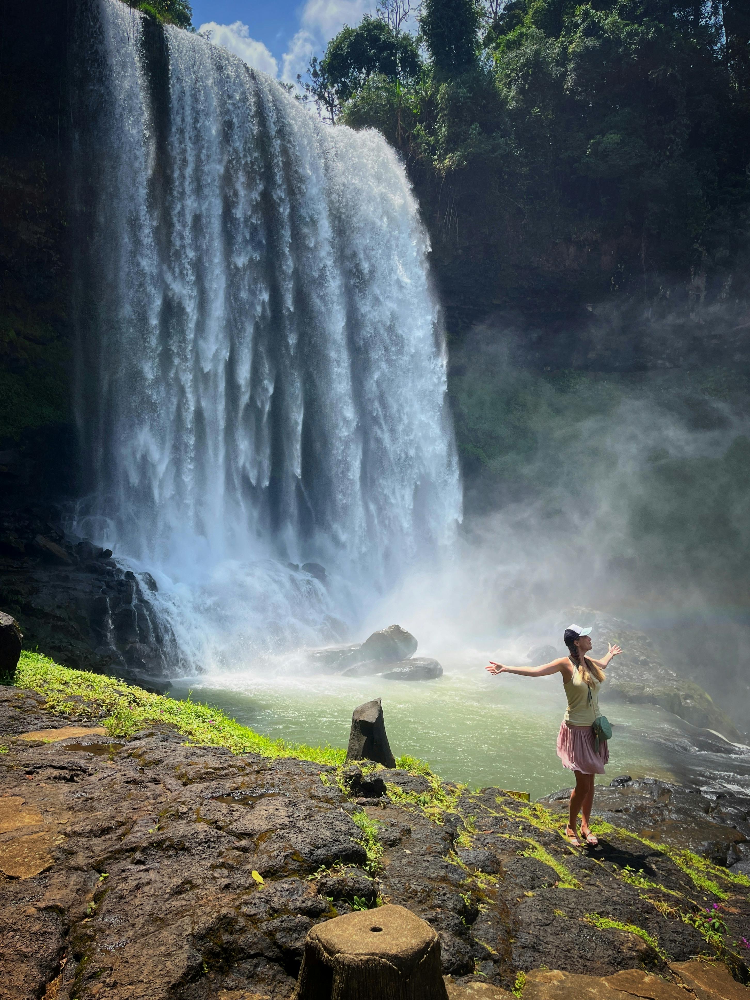 Woman With Open Arms By Waterfall
