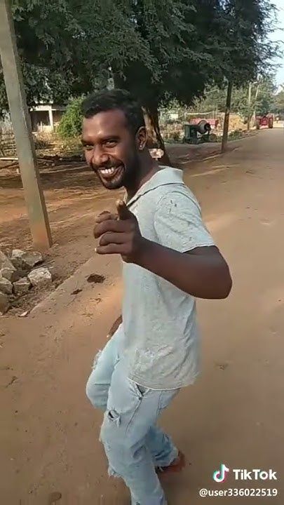 Smiling Man Giving Thumbs Up Outdoors