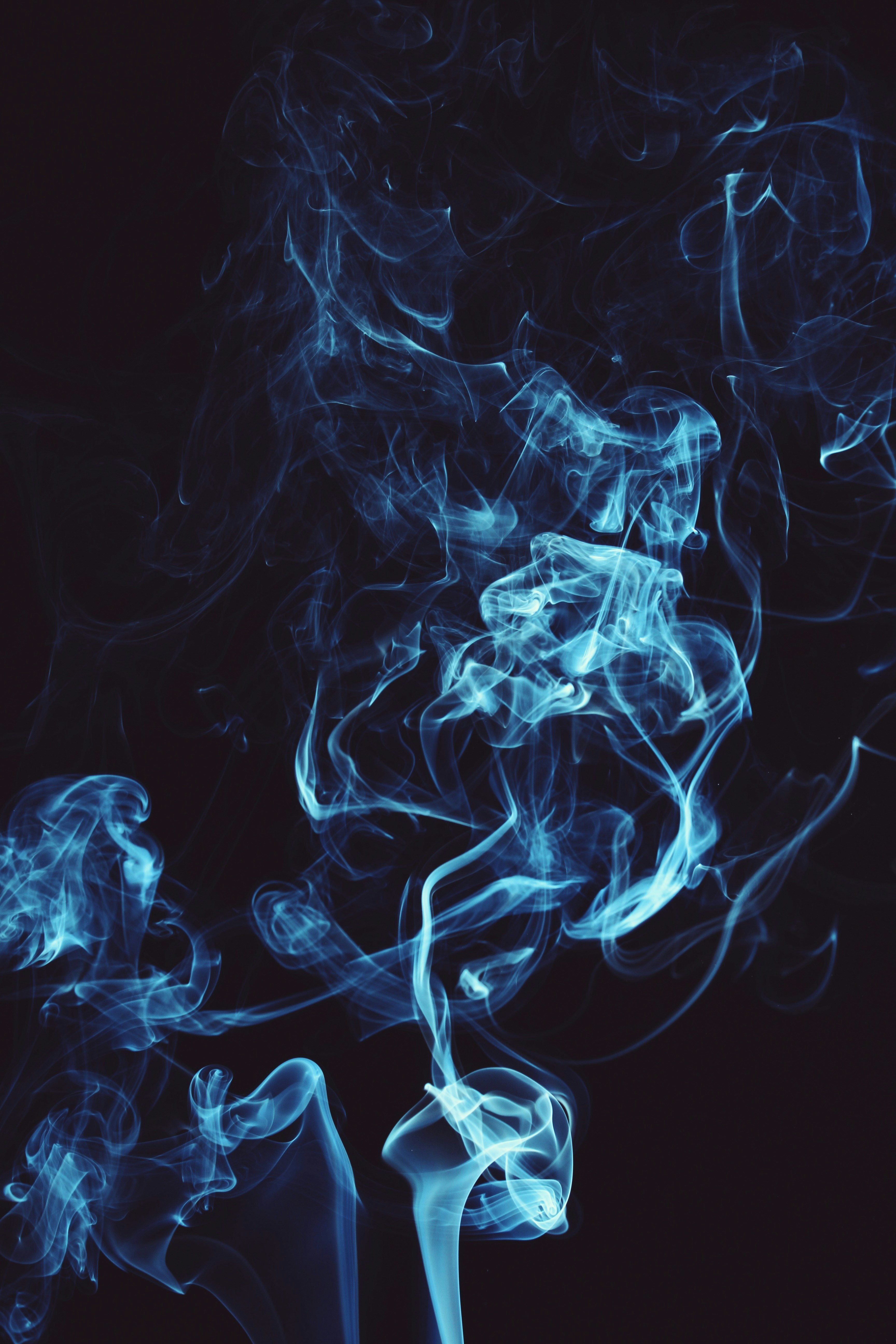Light Blue Smoke Against Dark Background