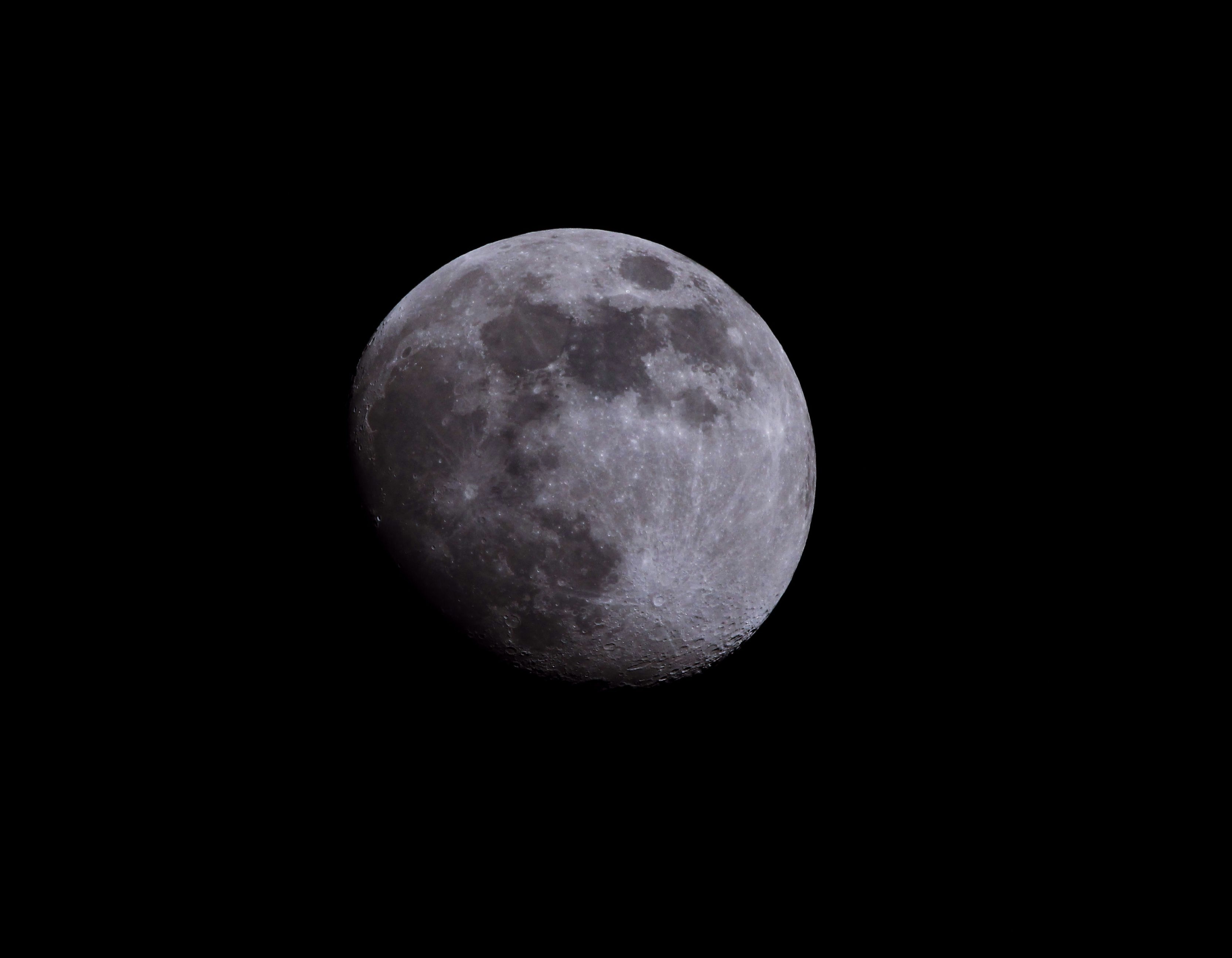 Gibbous Moon in Dark Night Sky