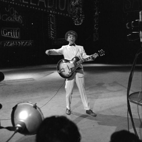 Guitarist Performing on Stage