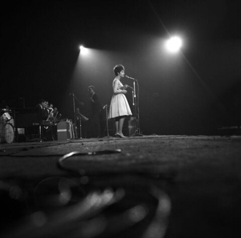 Female Singer Performing on Stage