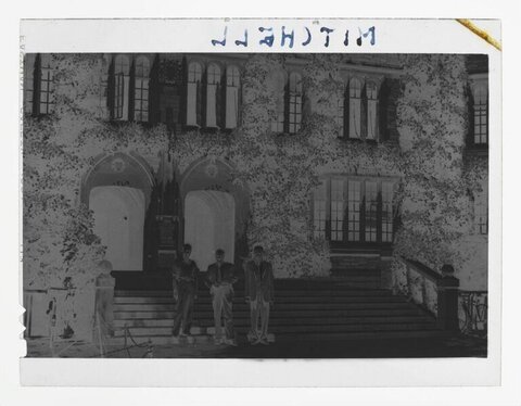 Three Men at Building Entrance Steps