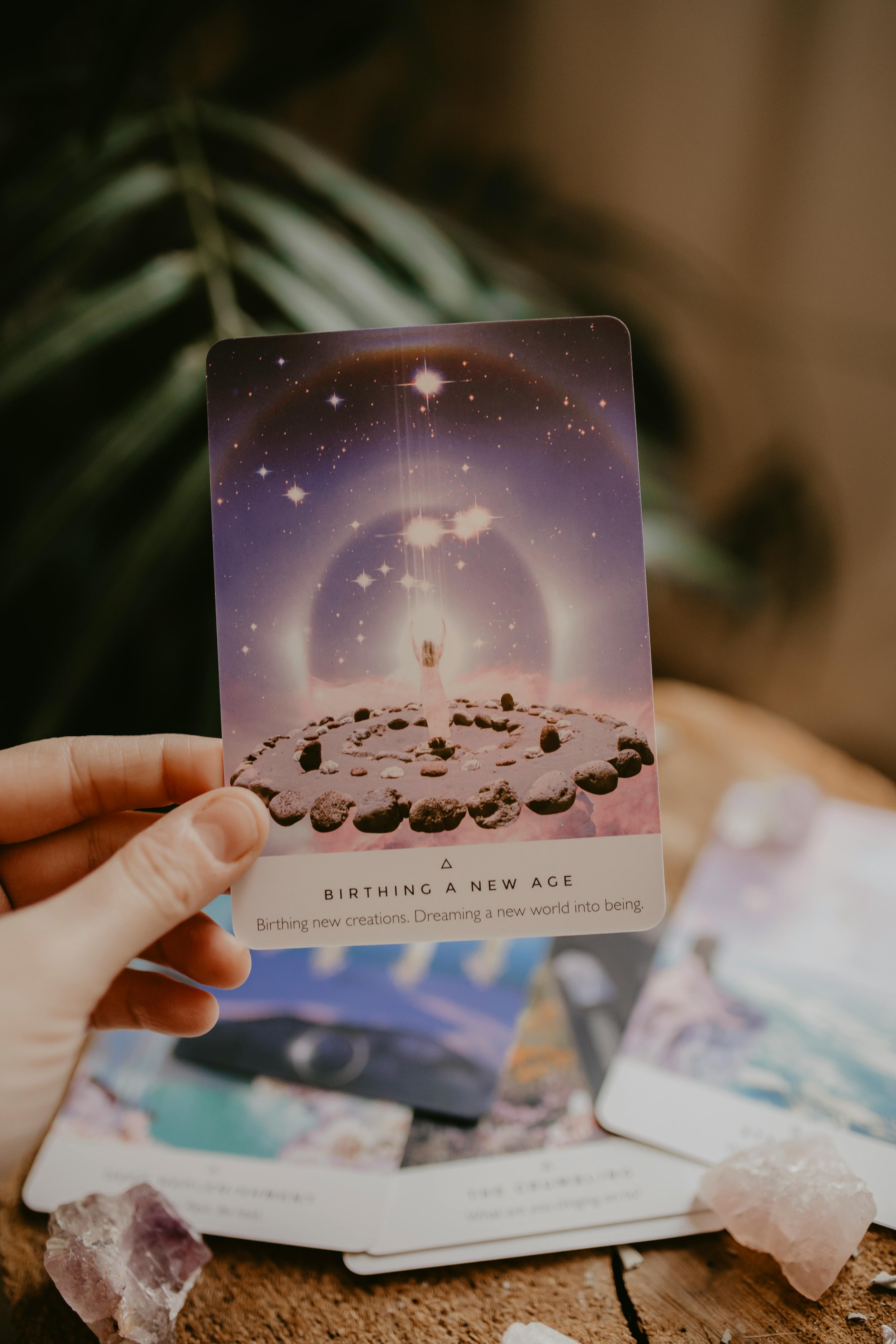 Hand Holding Birthing a New Age Oracle Card