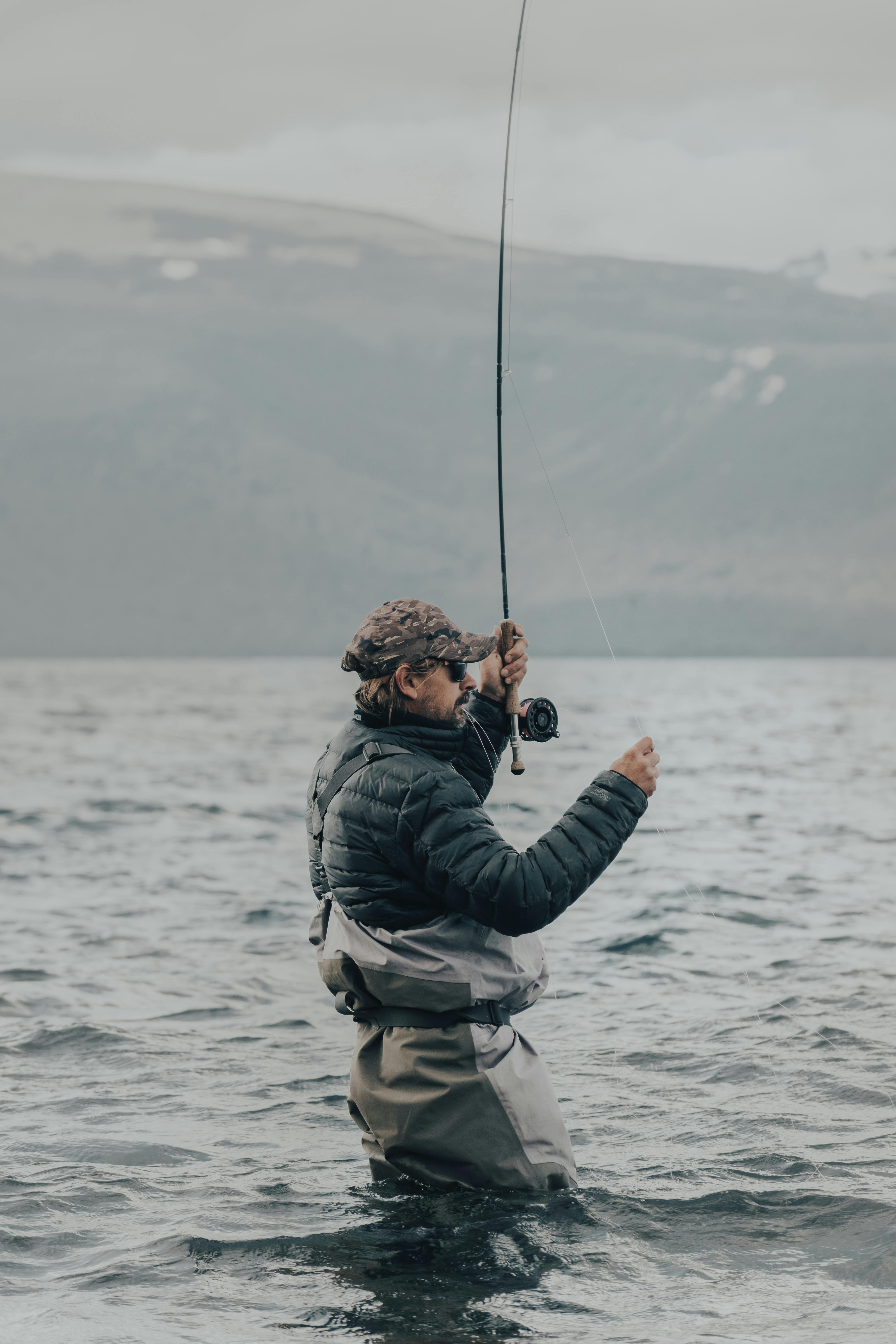 Man Fly Fishing In Open Water