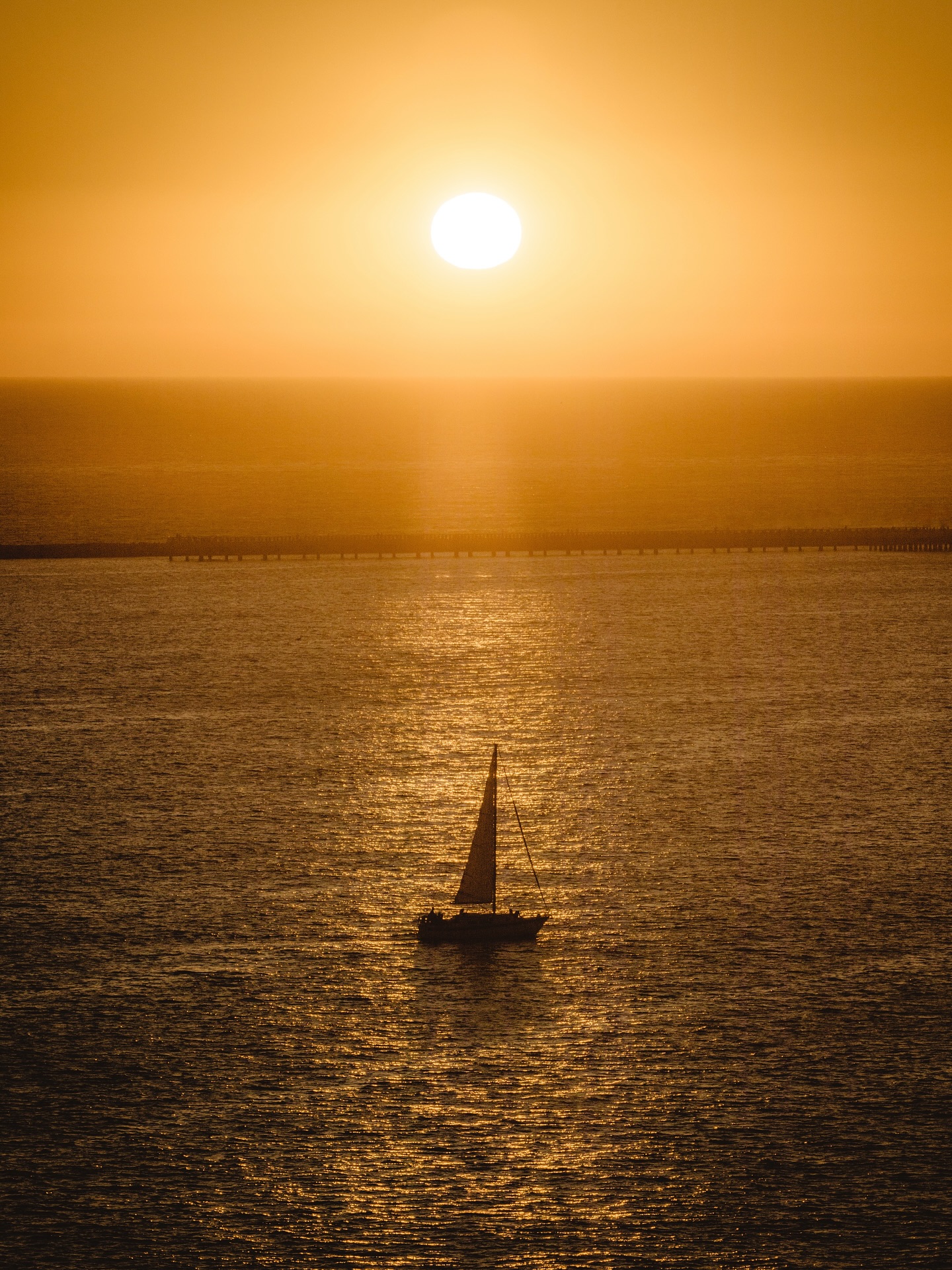 Sailboat on Sea at Sunset