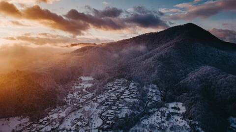 Snowy Mountain Village at Sunset
