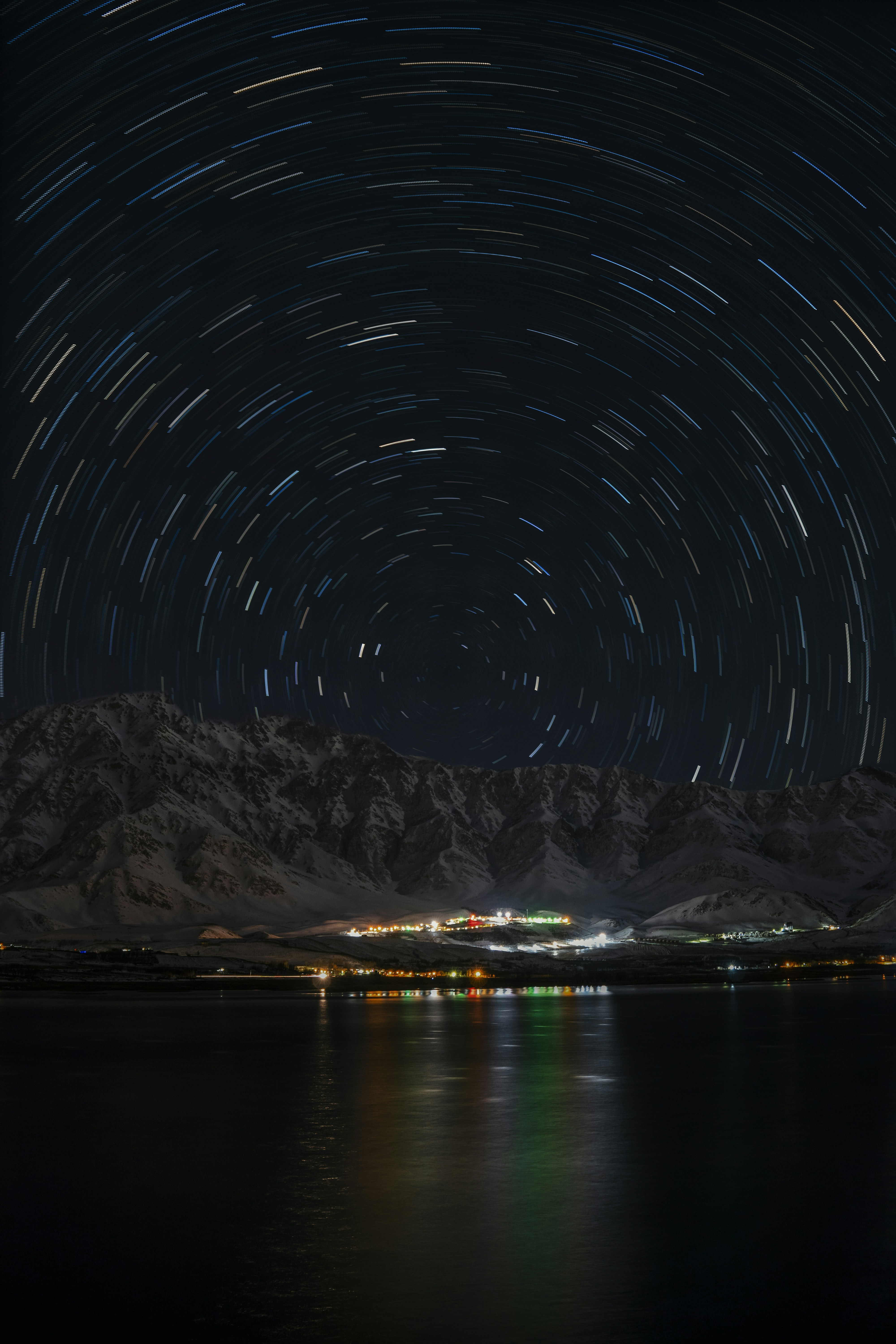 Night Star Trails Over Snow Mountain Lake