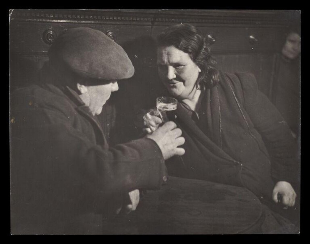 Two Adults Toasting at a Pub