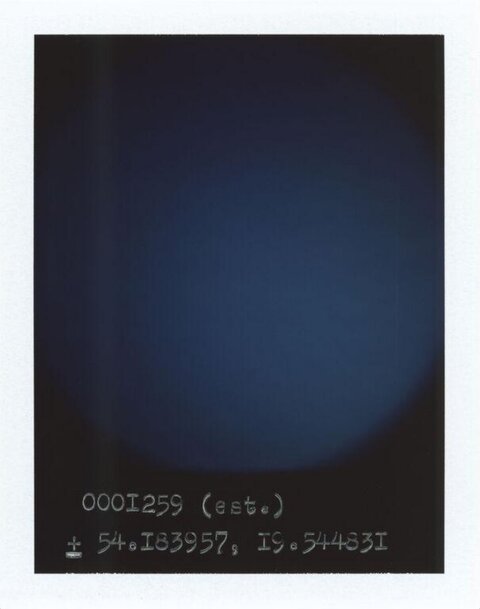 Polaroid With Handwritten Coordinates
