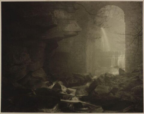 Waterfall View Through Stone Arch