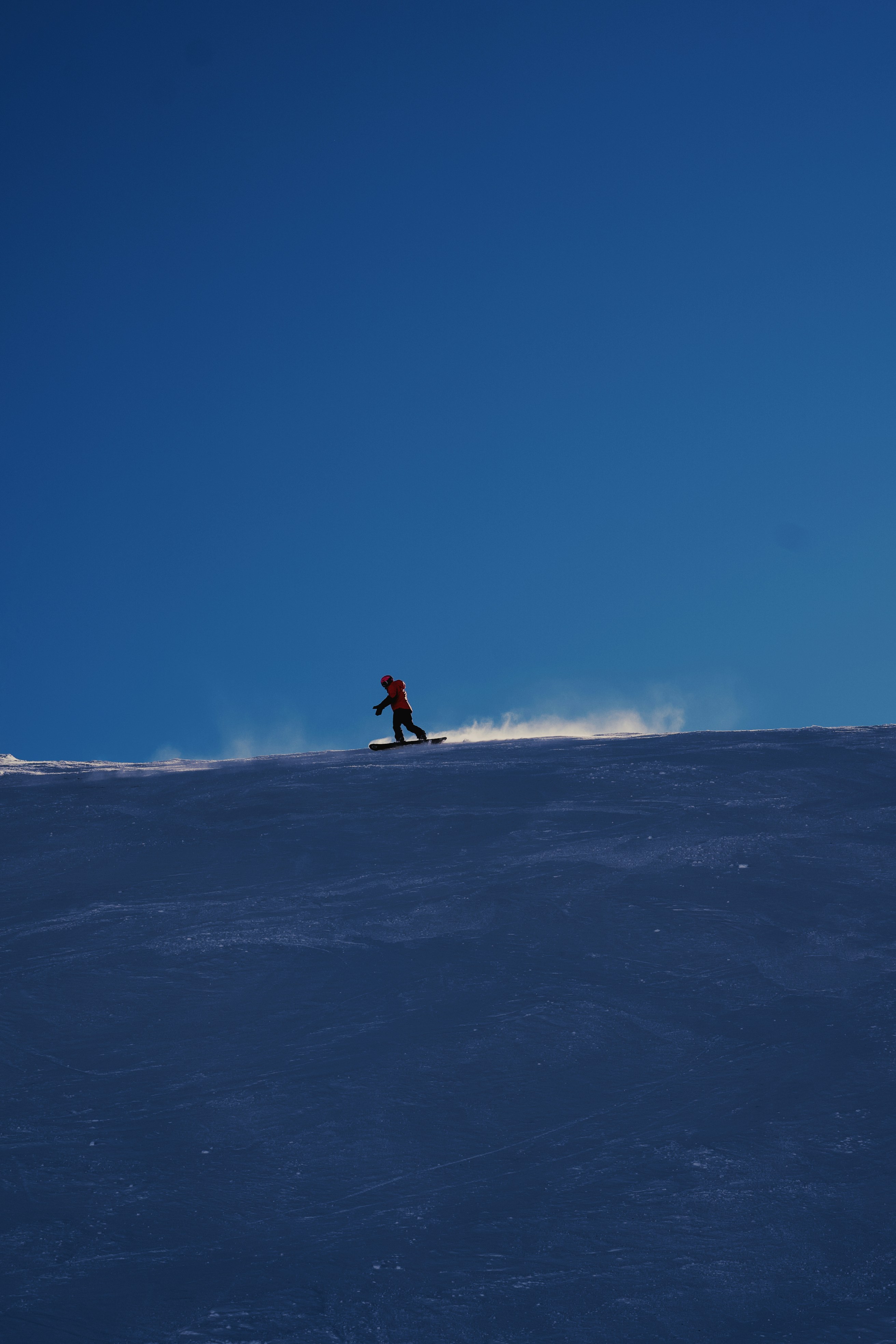 Snowboarder Riding Snowy Slope