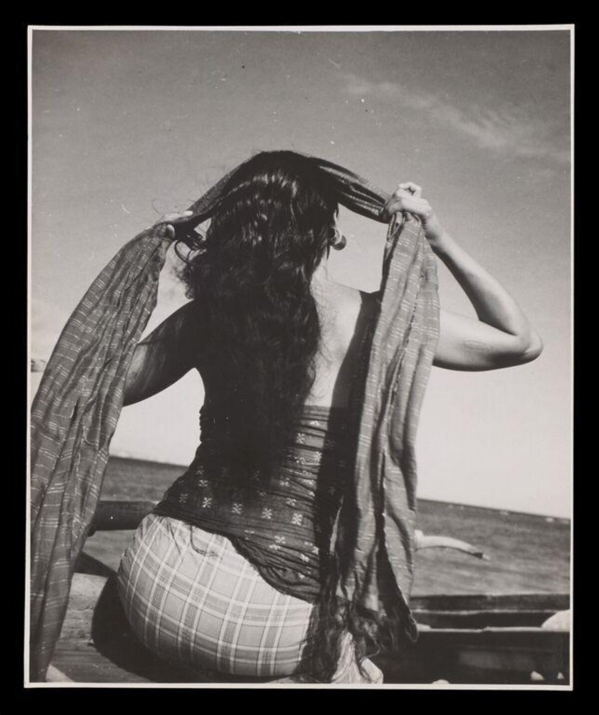 Back View of Woman by the Sea