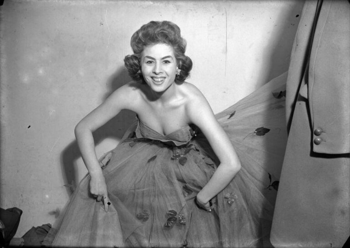 Smiling Woman in Strapless Evening Gown