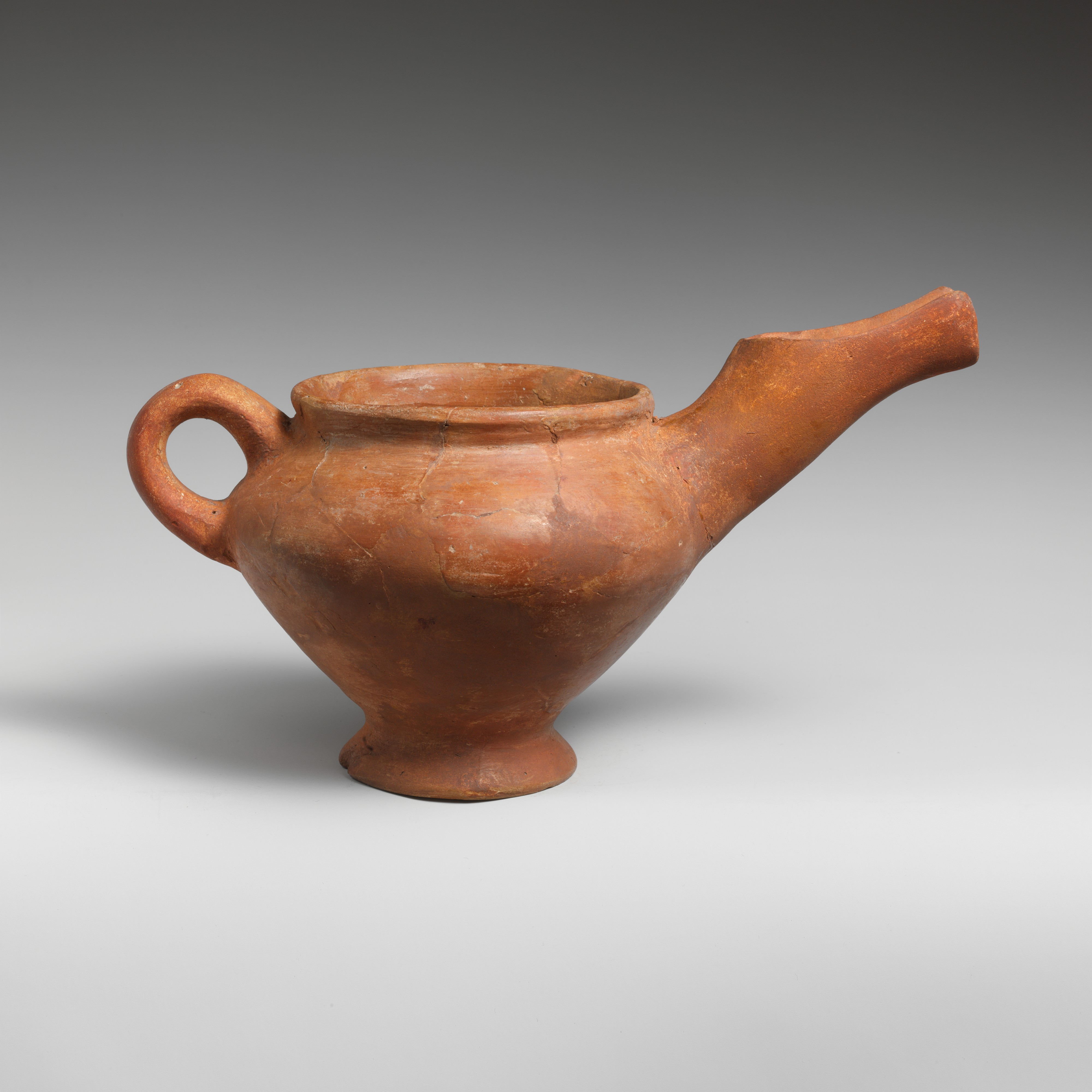 Ancient Red Pottery Spouted Pitcher — History