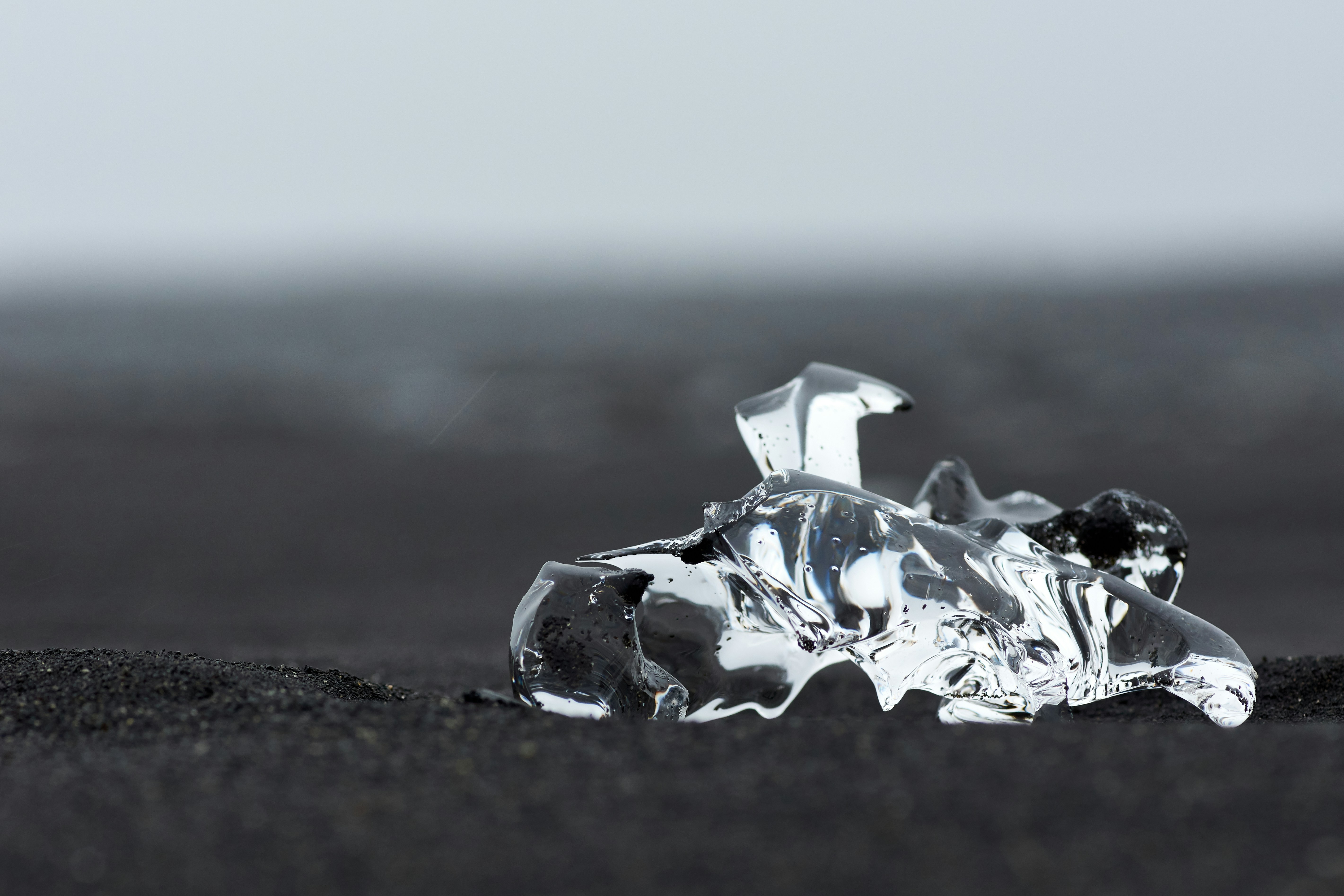 Transparent Ice on Black Sand