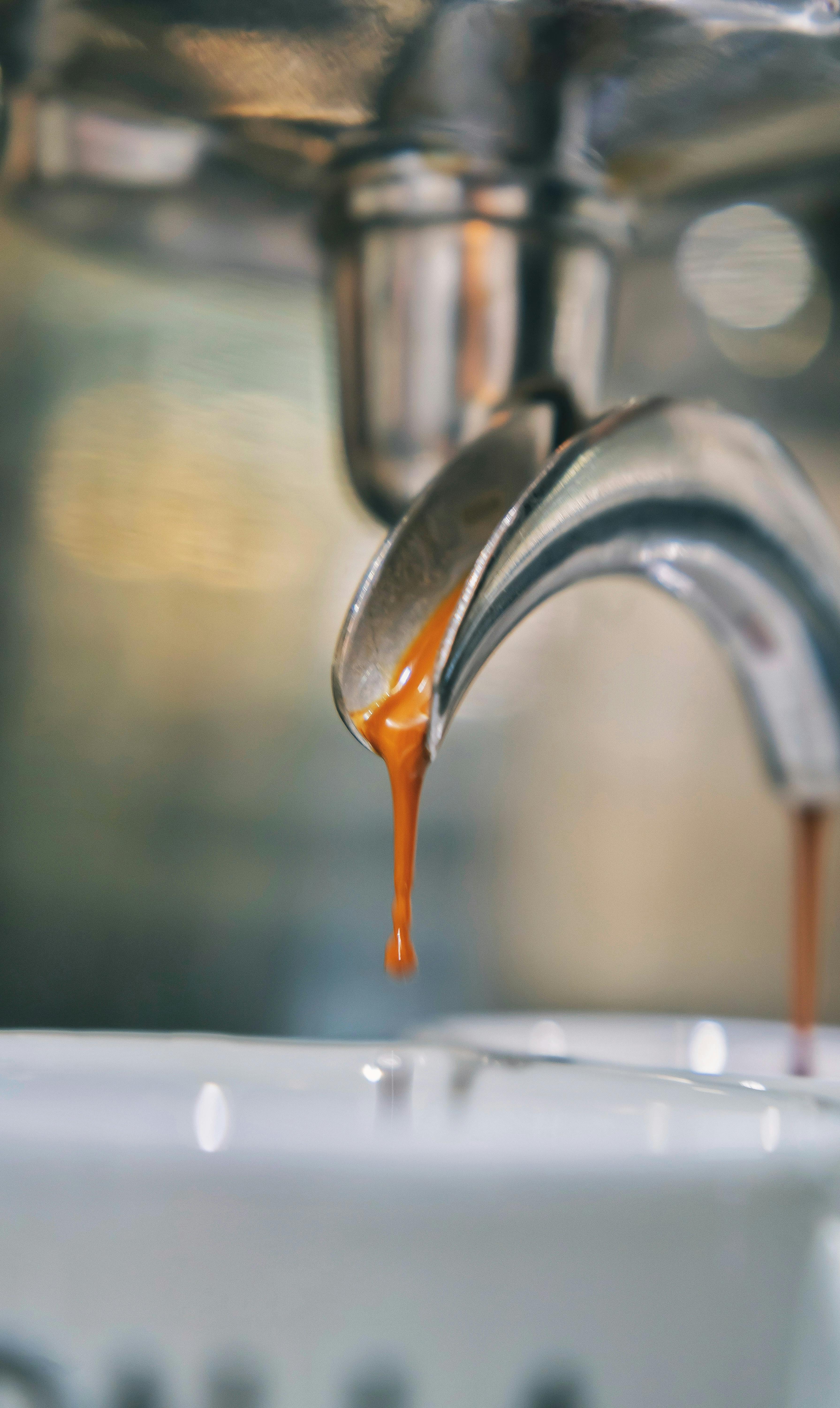 Espresso Dripping From Coffee Machine