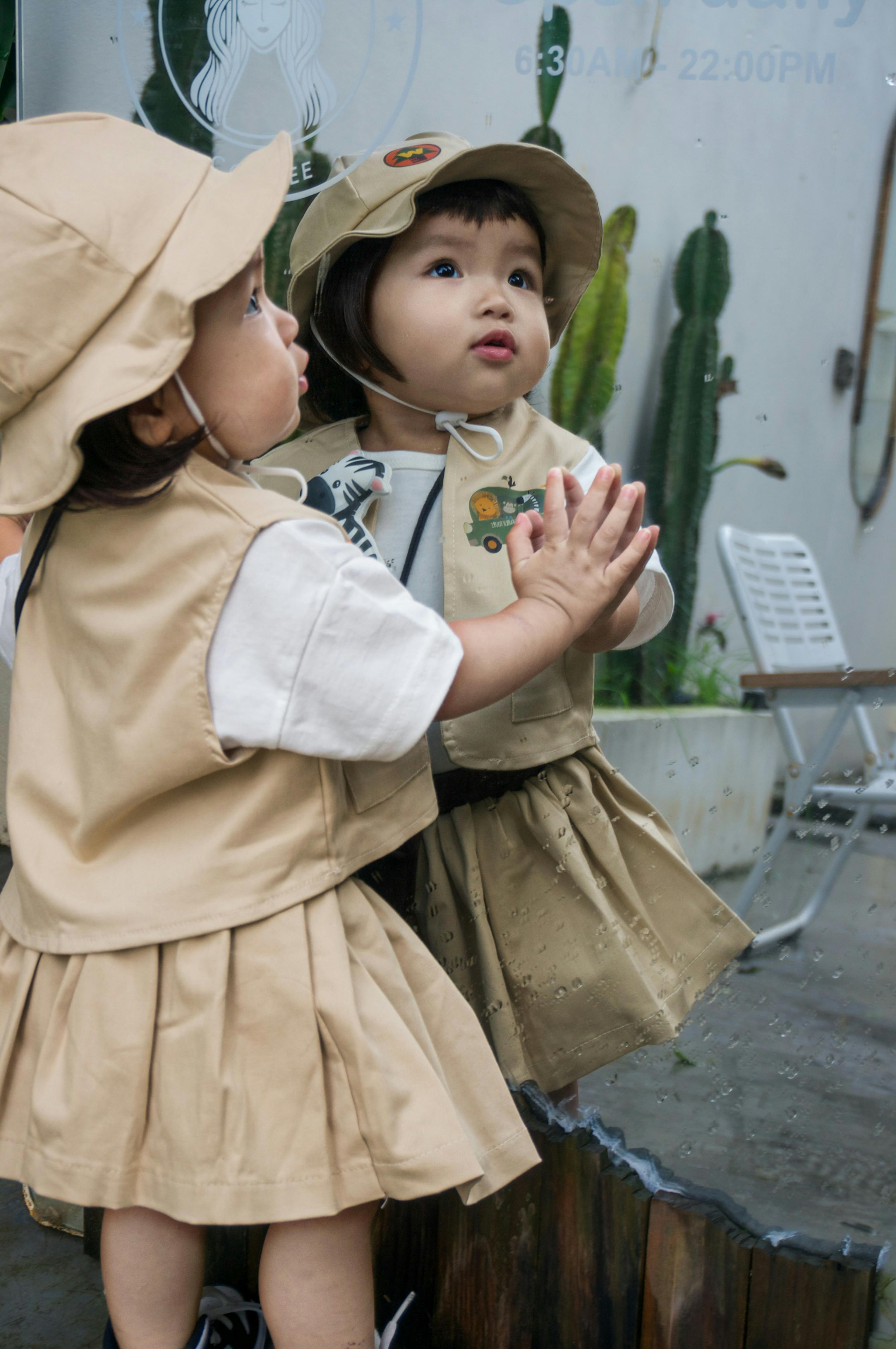Toddler Looking At Her Own Reflection