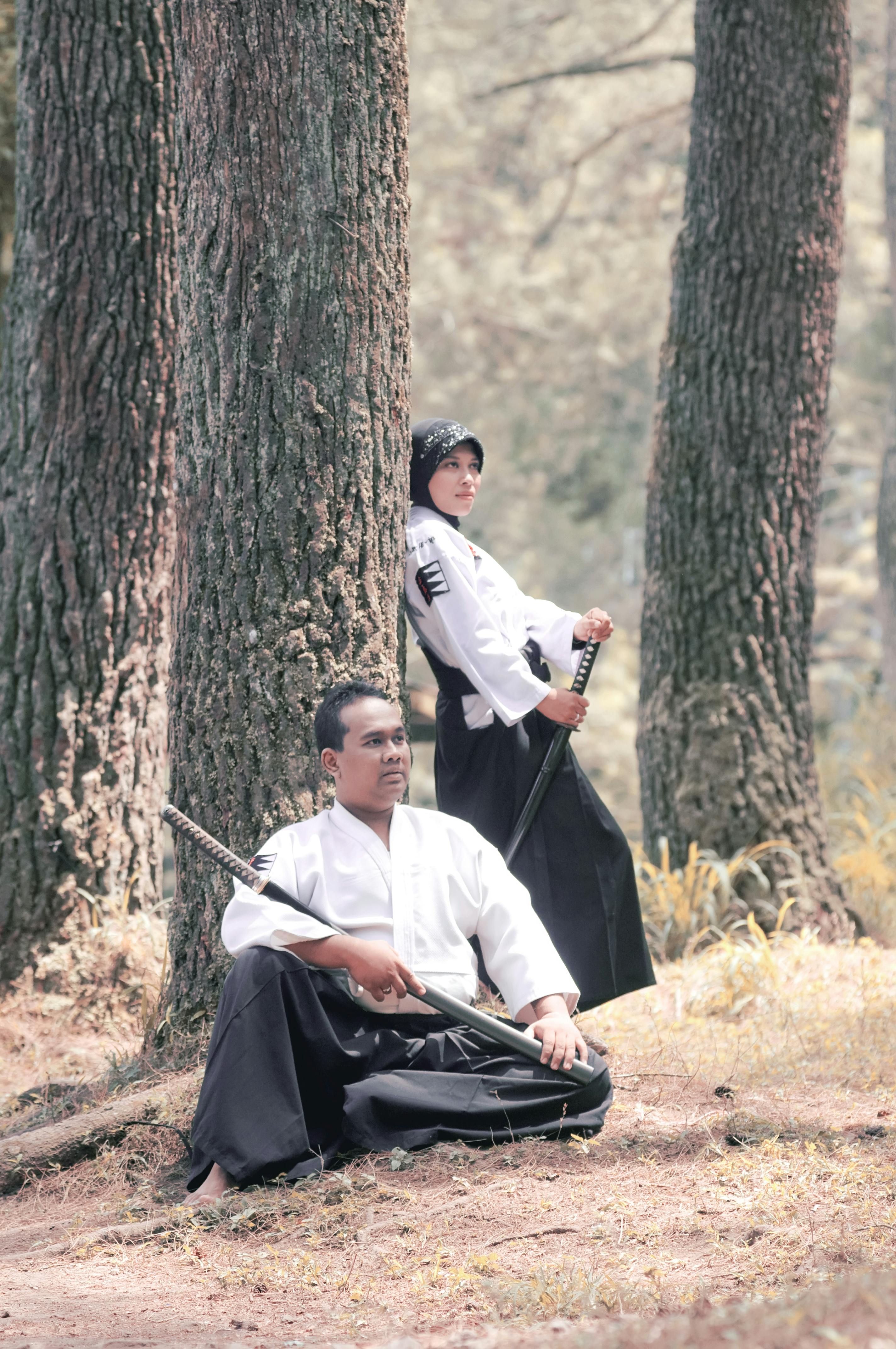 Two Martial Artists In Pine Forest