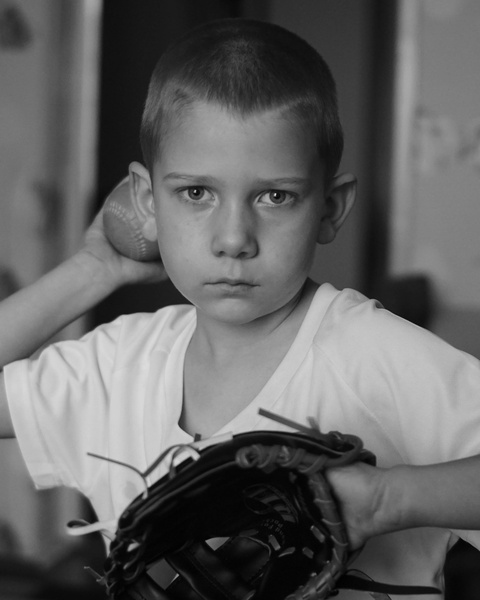 Young Boy Pitching Baseball