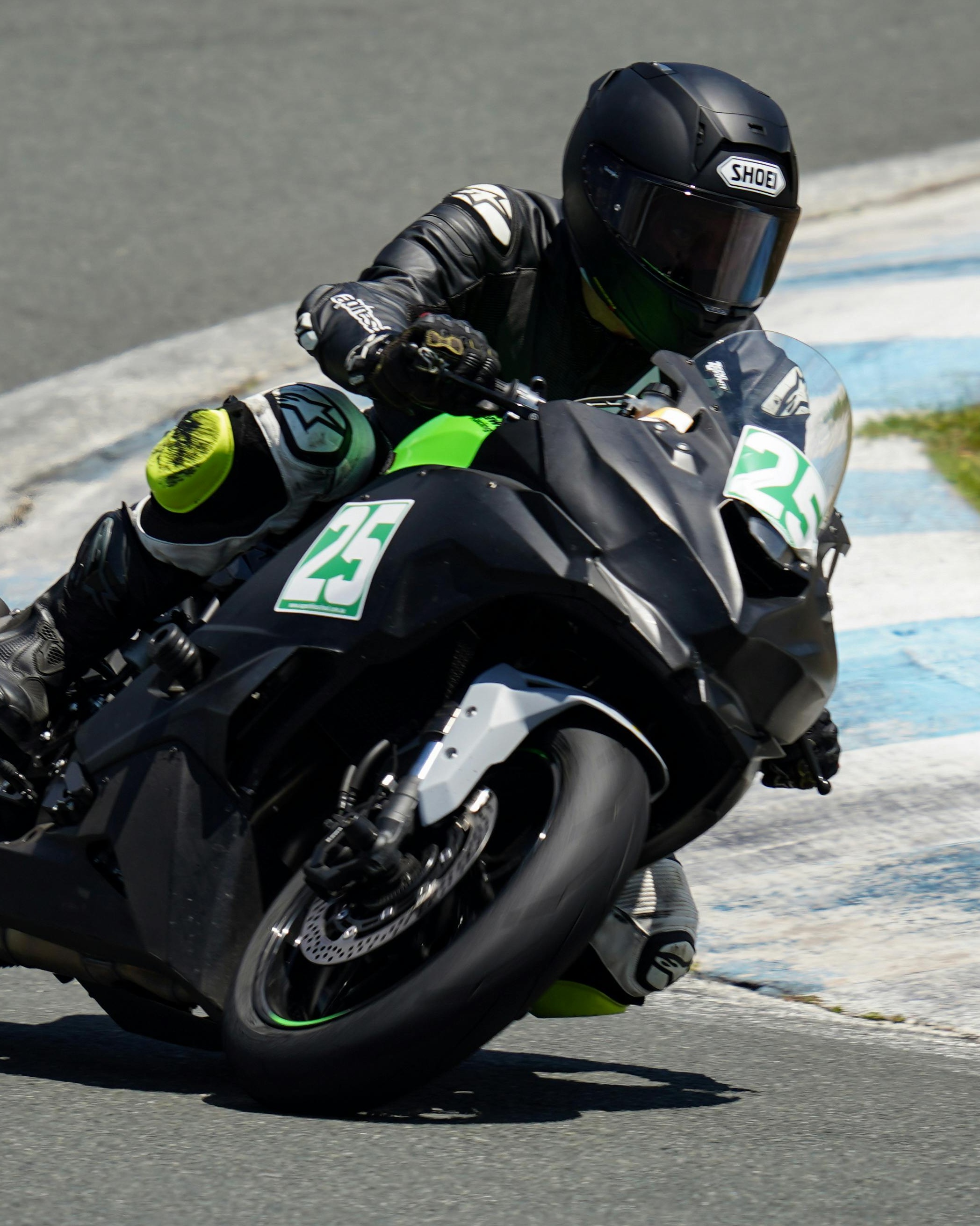 Motorcycle Racer Cornering on Race Track