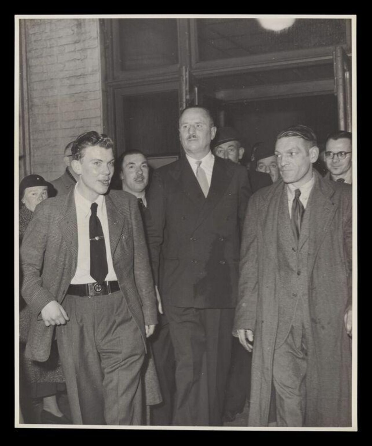Vintage Men at Building Entrance