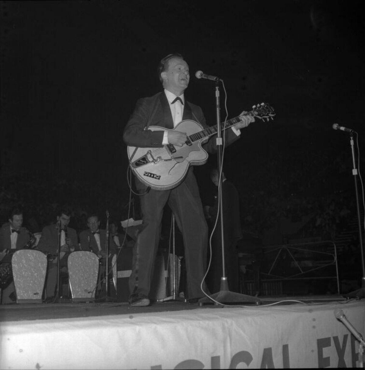 Guitarist Performing On Stage