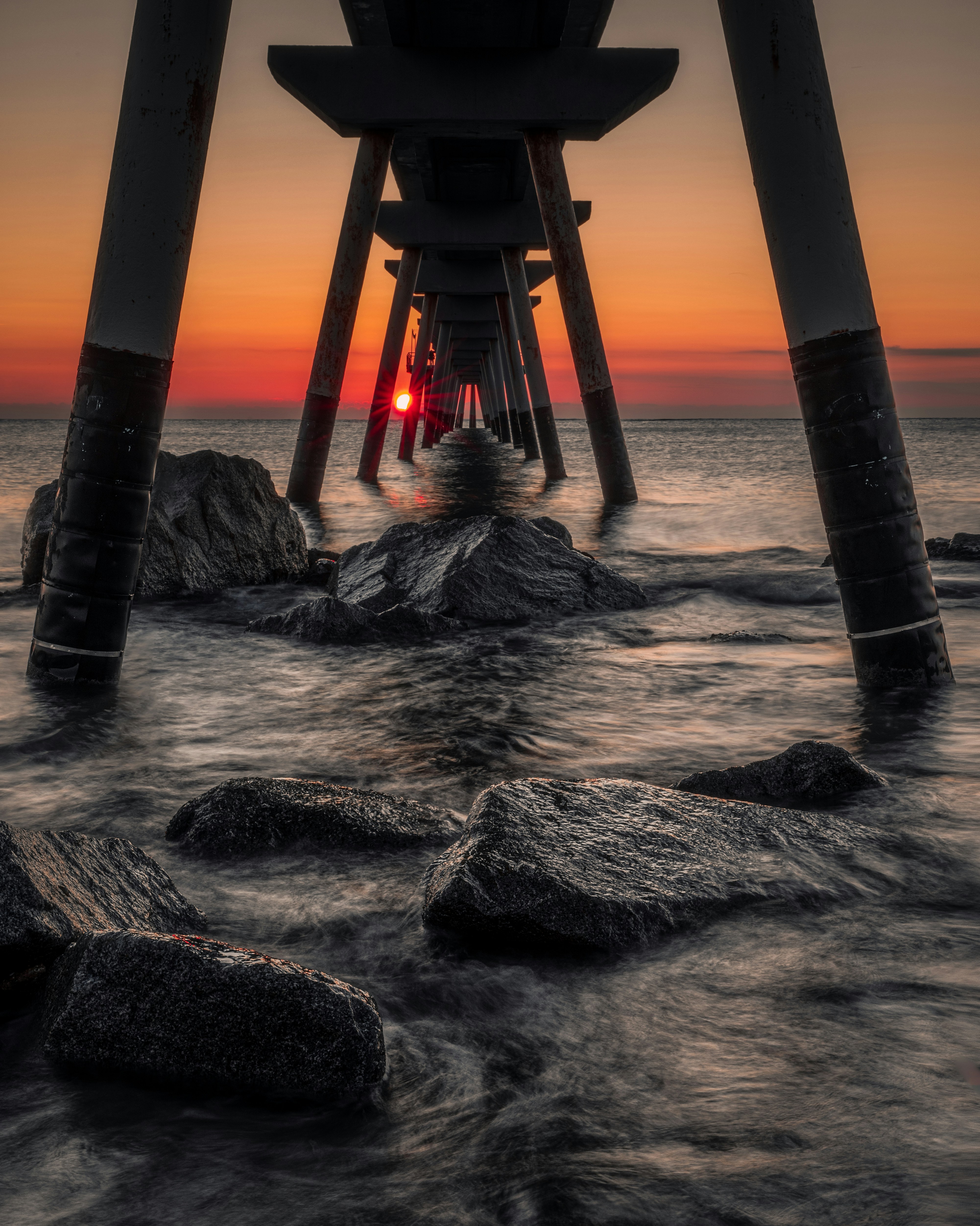Sunset Under Coastal Pier