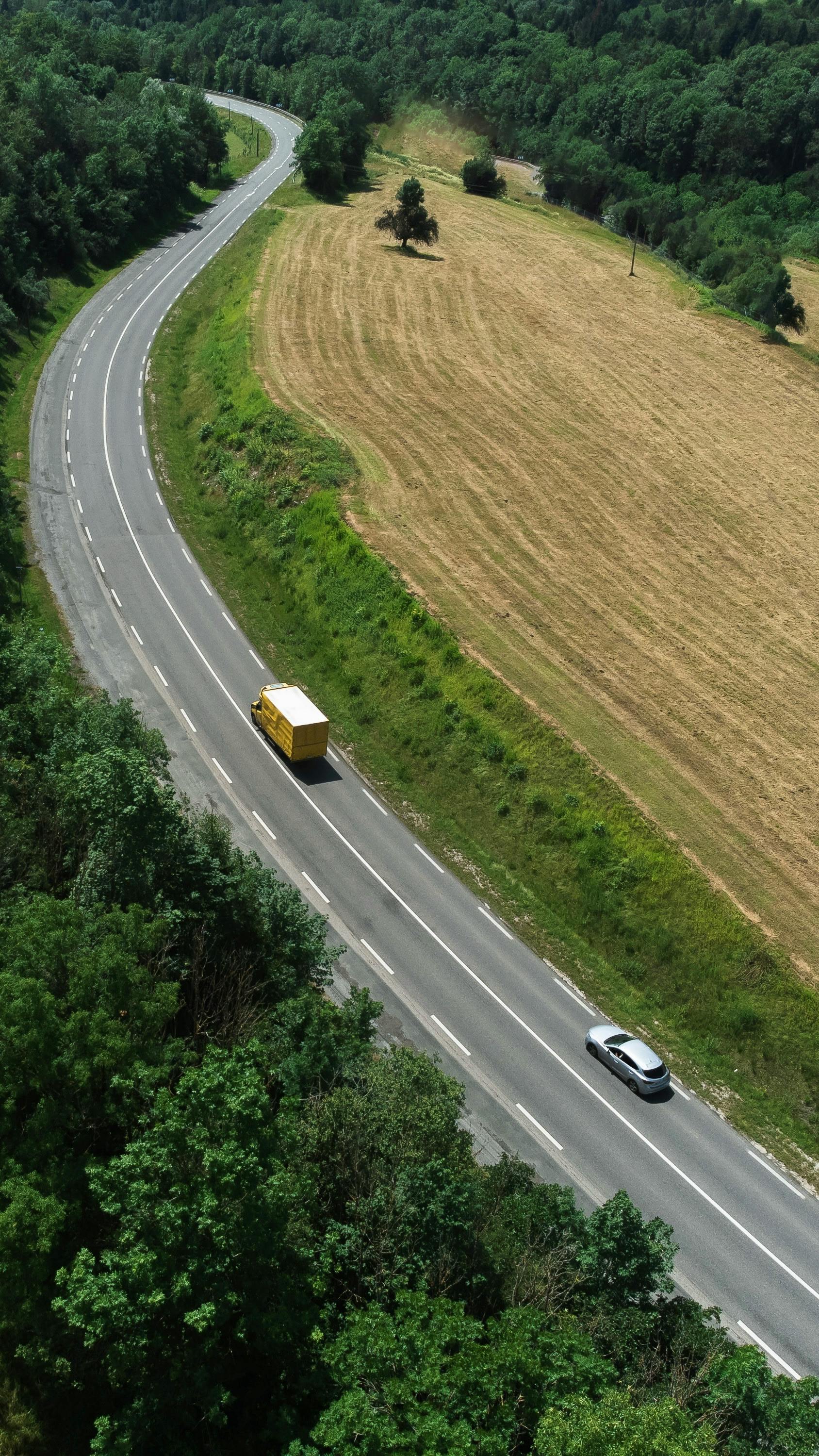 Two Vehicles on Winding Rural Road