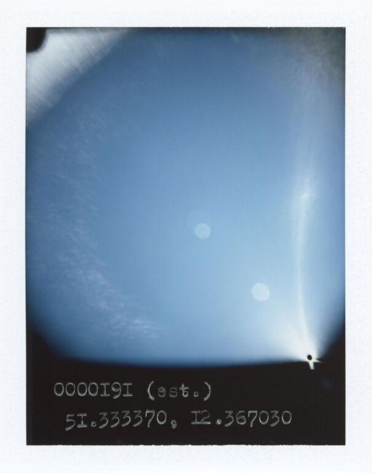 Blue Sky Polaroid with Handwritten Coordinates