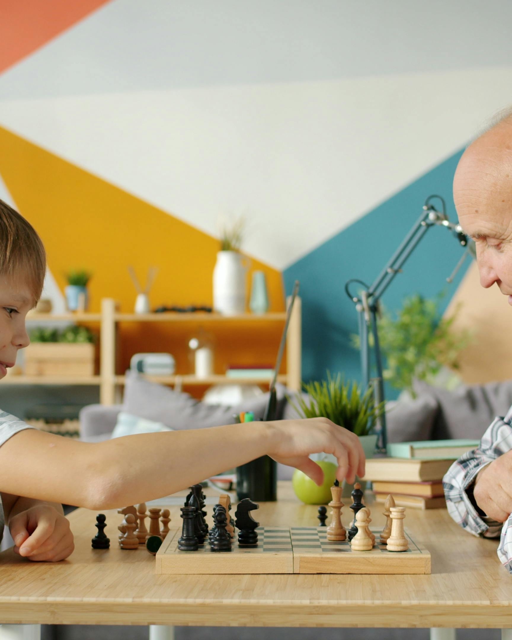 Boy and Grandfather Playing Chess
