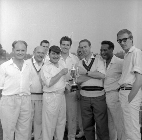 Cricket Team Celebrating With Trophy
