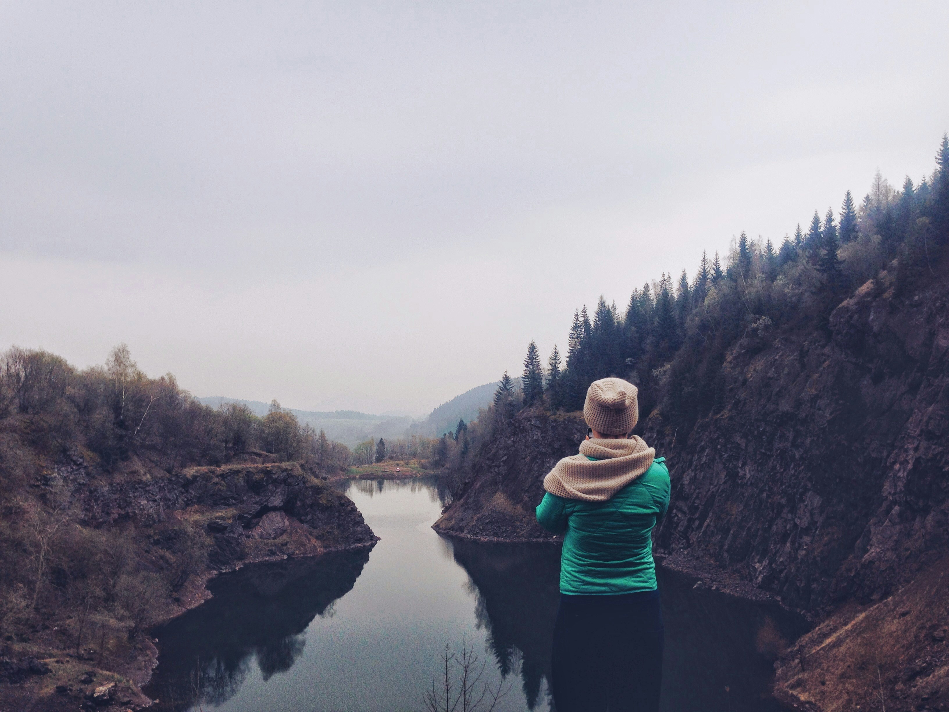 Person Overlooking Mountain Lake