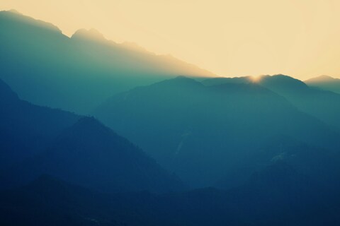 Sunrise Over Layered Mountains