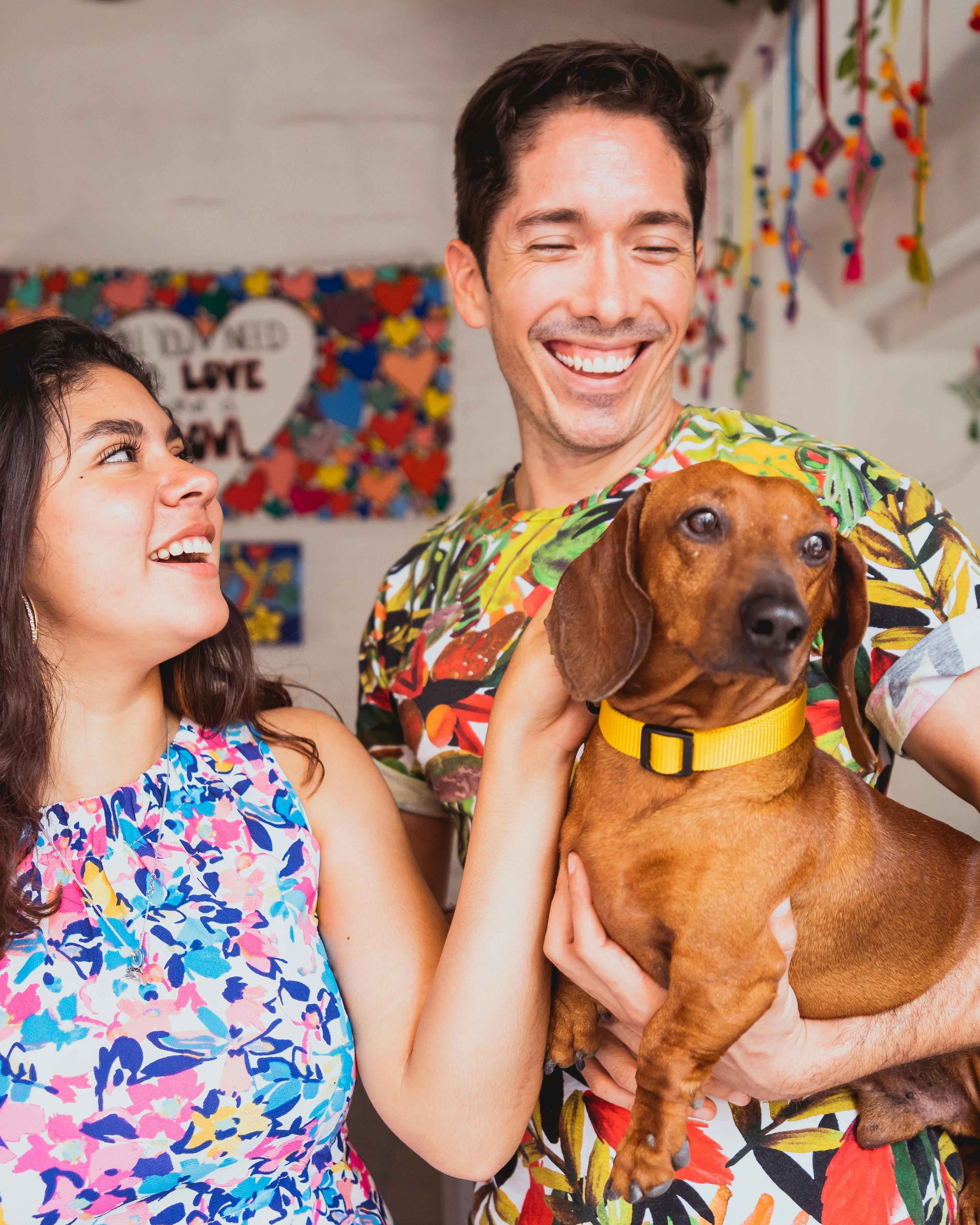 Happy Couple And Their Dachshund