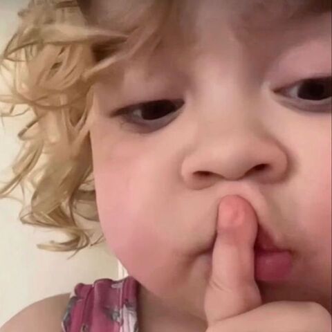 Toddler Making Shush Gesture