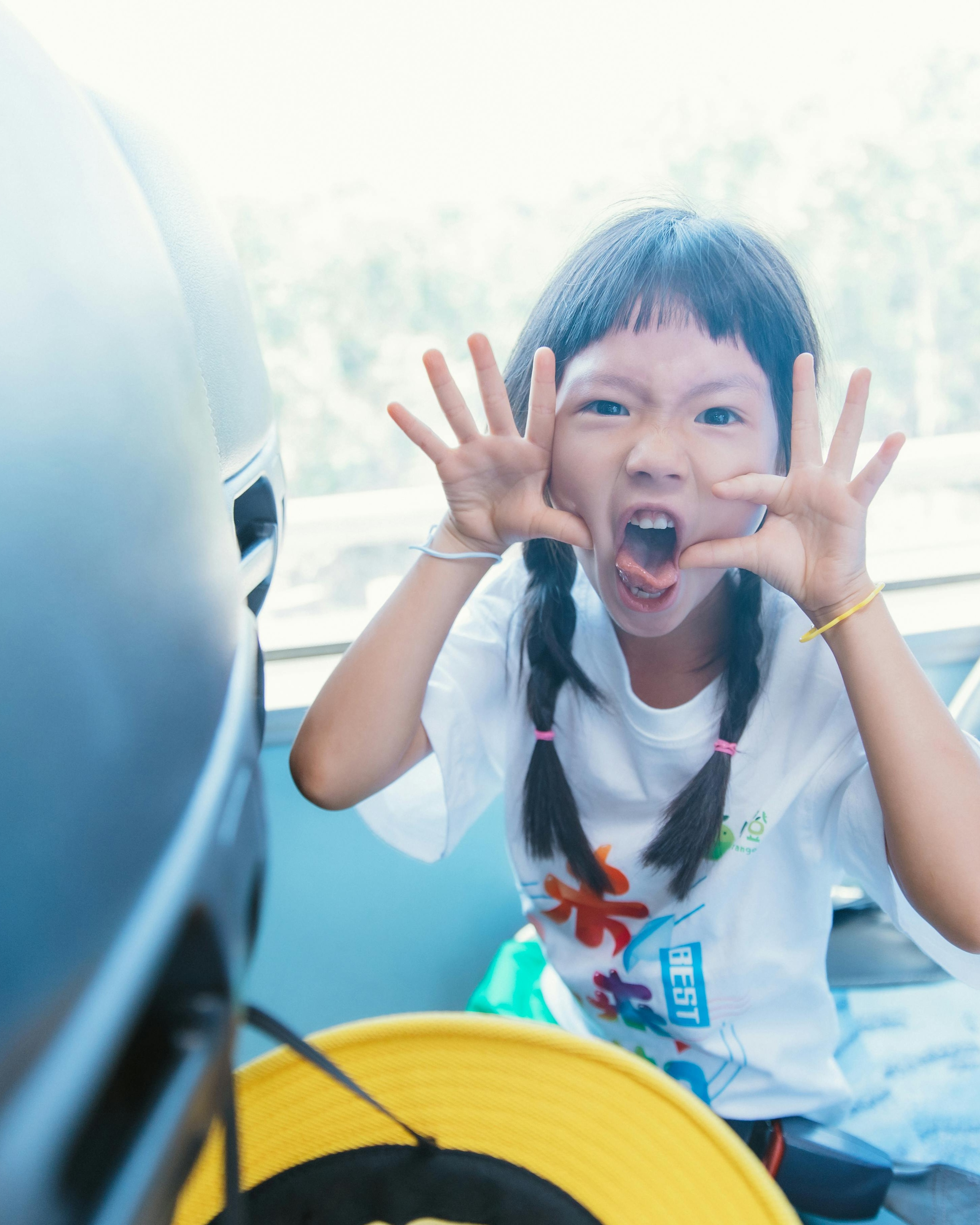 Girl Making Funny Face in Vehicle