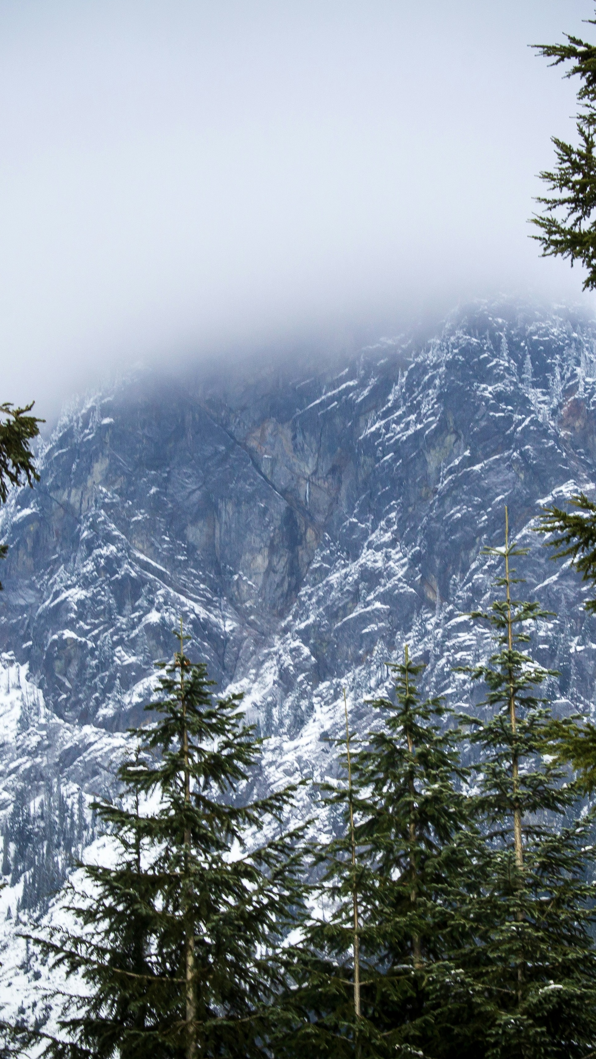 Snowy Mountain Shrouded in Fog