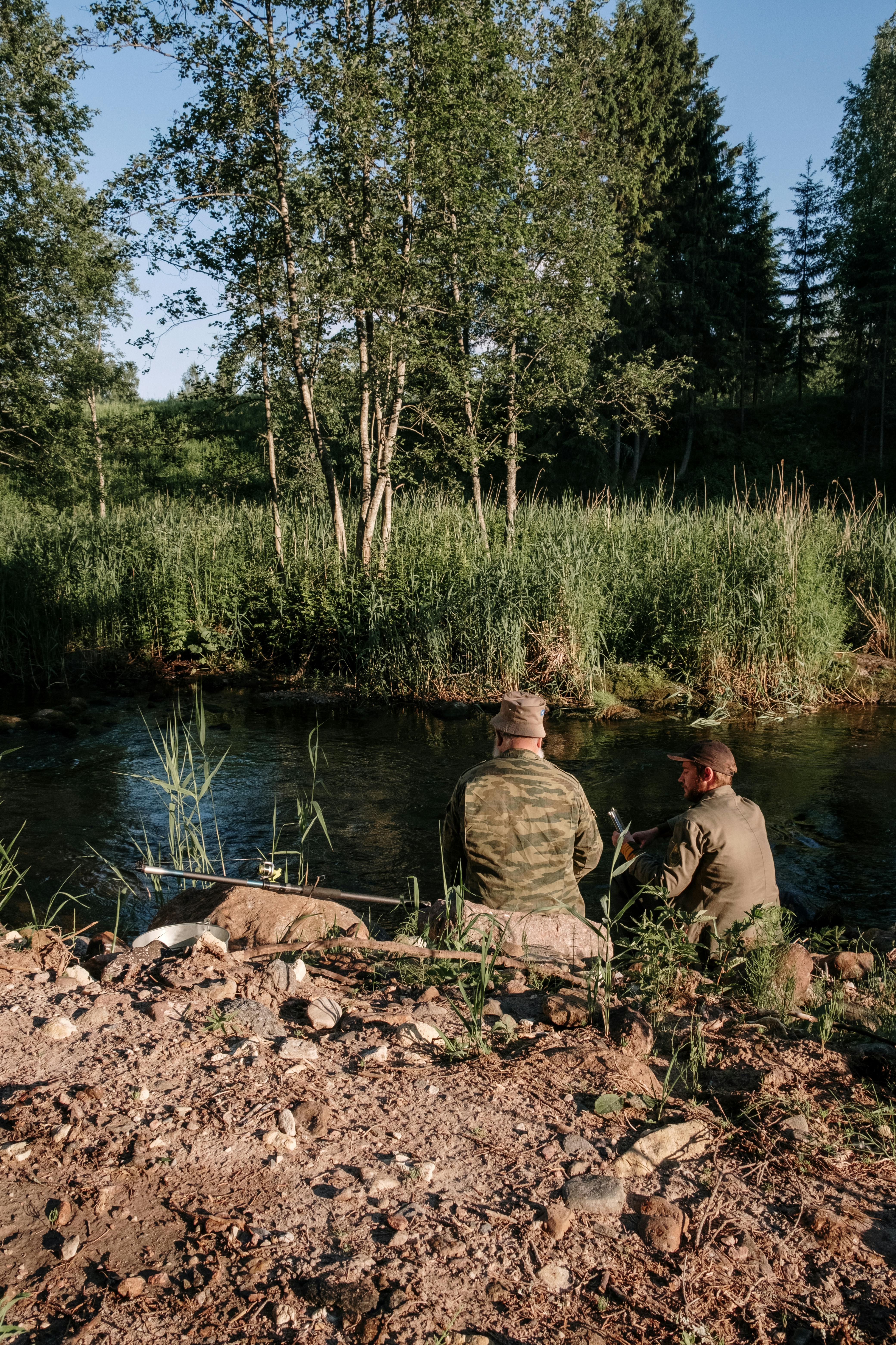 Two Men Fishing by Forest River