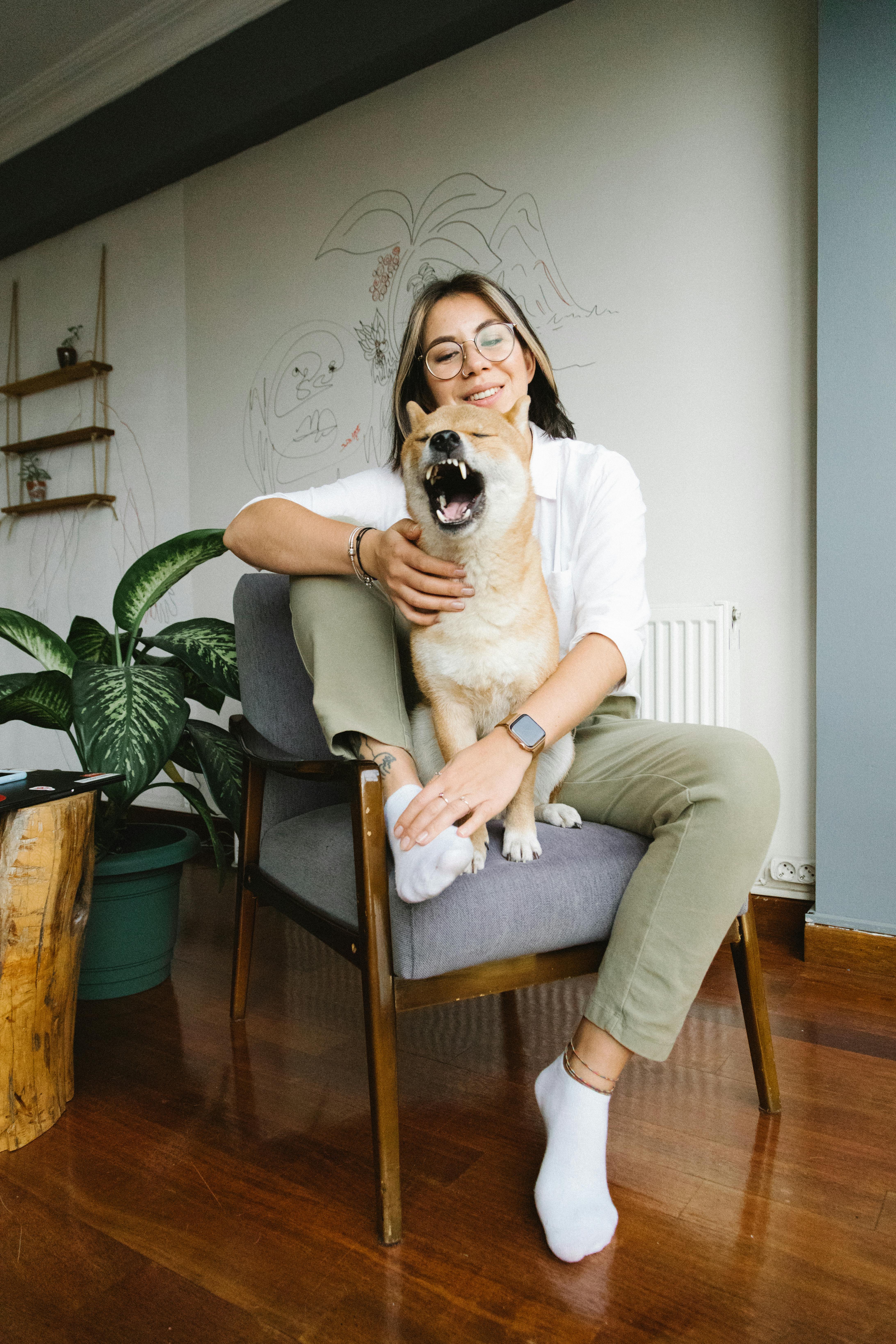 Woman and Shiba Inu Relaxing at Home
