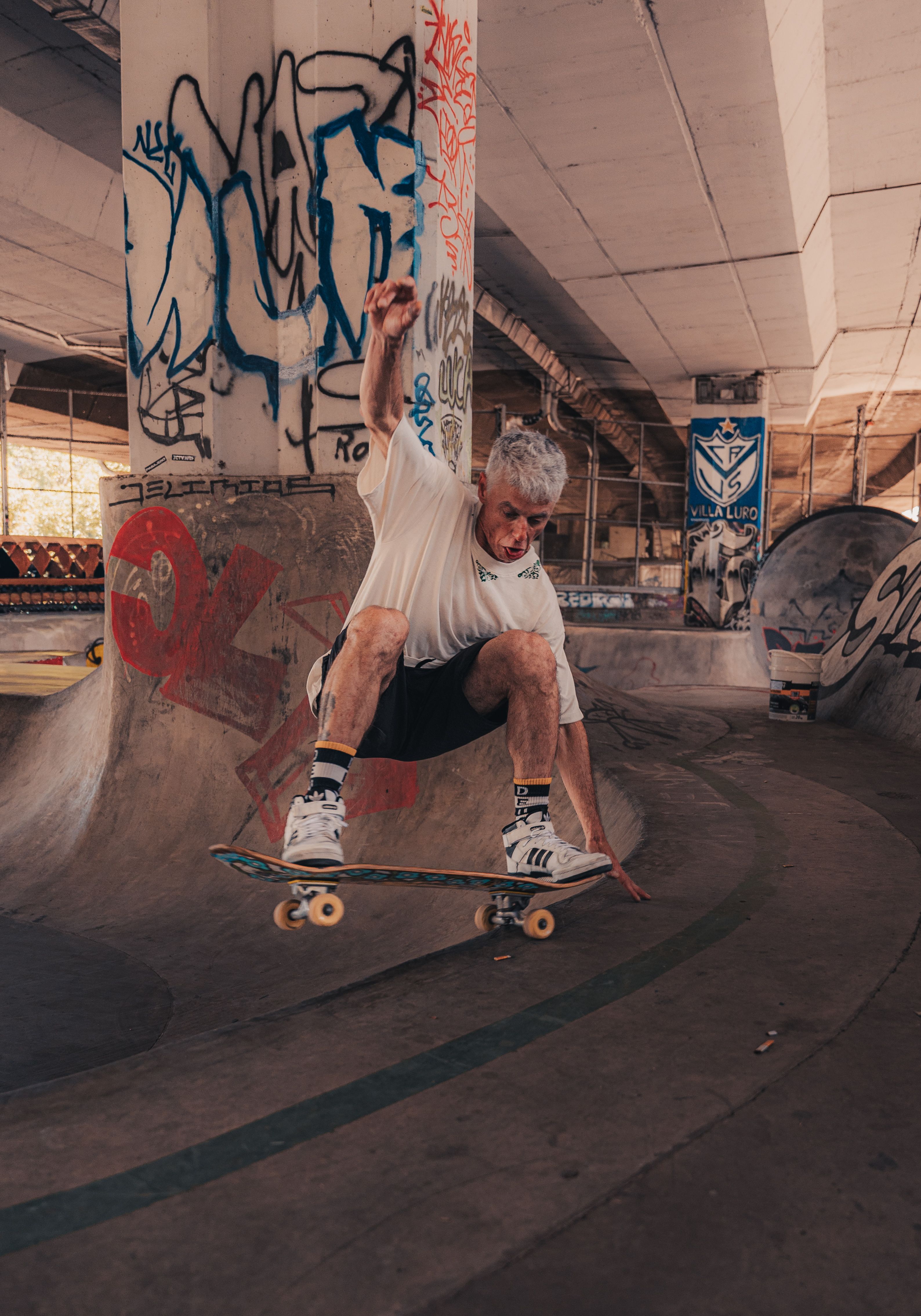 Older Man Skateboarding at Skatepark