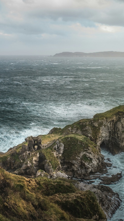 Castle Ruins on Stormy Coastal Cliffs