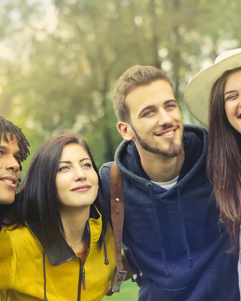 Four Young Friends Hanging Out Outdoors