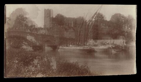 Vintage River View with Stone Bridge and Church