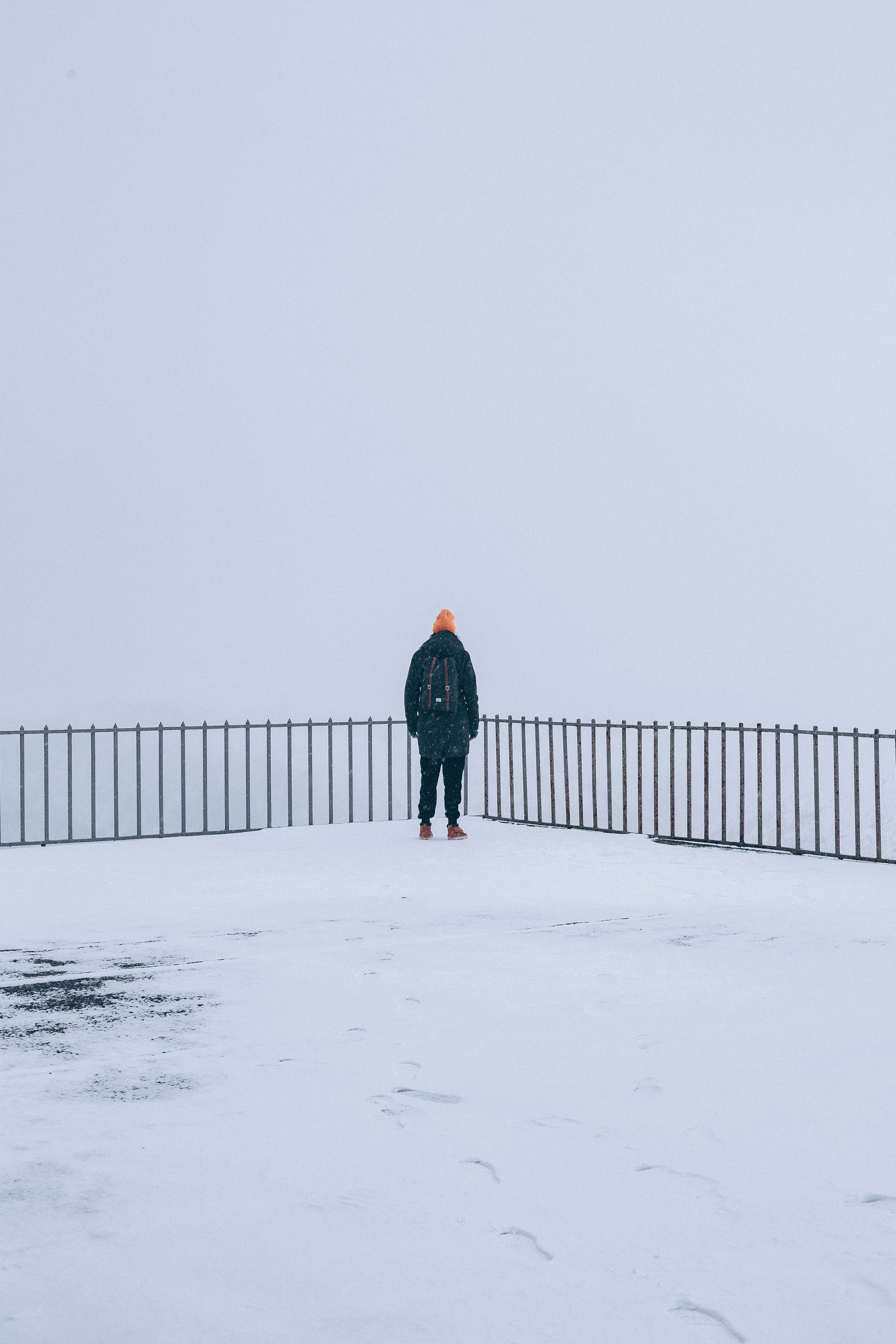 Lone Person at Snowy Foggy Viewpoint
