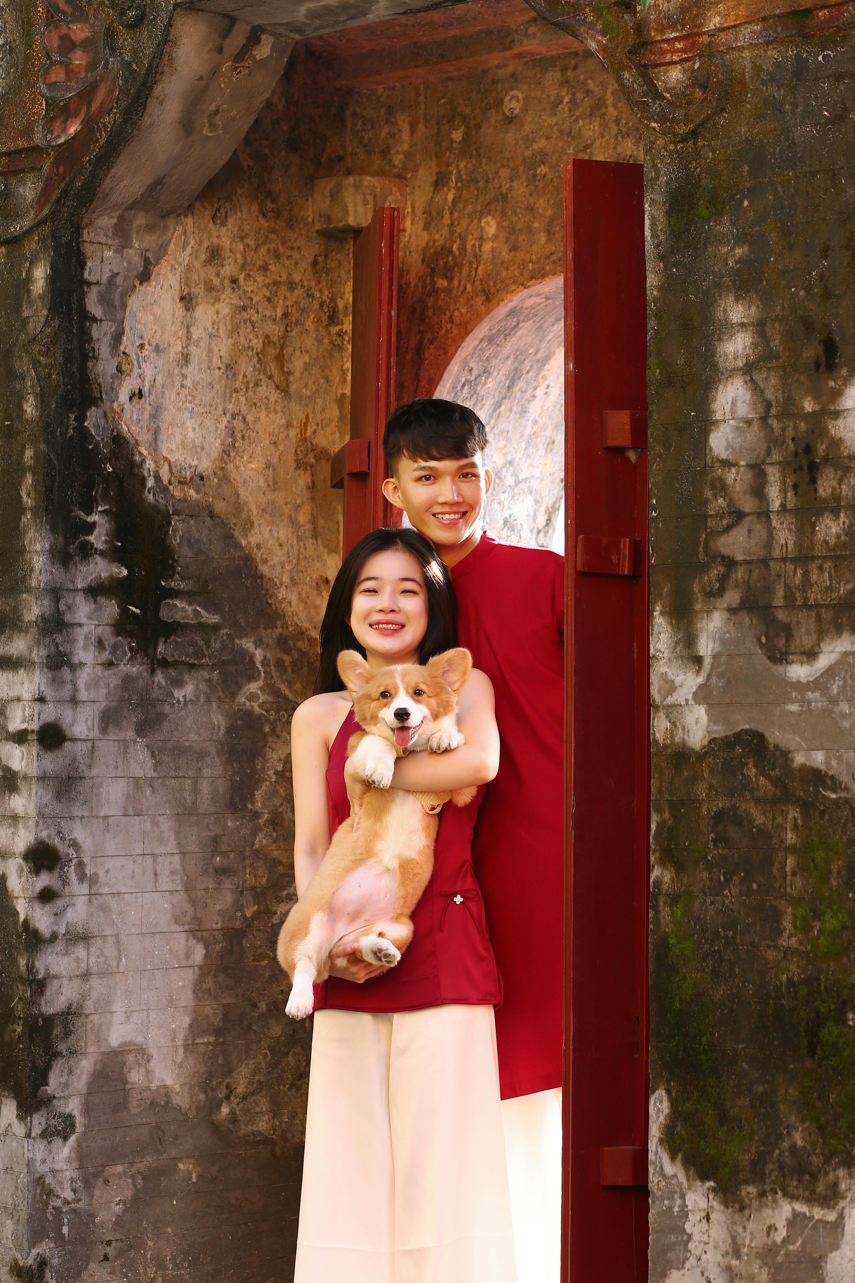 Young Couple With Corgi Portrait