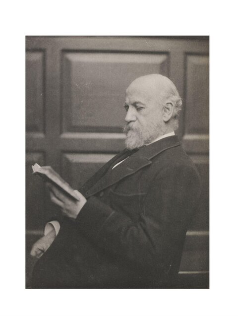 Elderly Balding Man Reading a Book