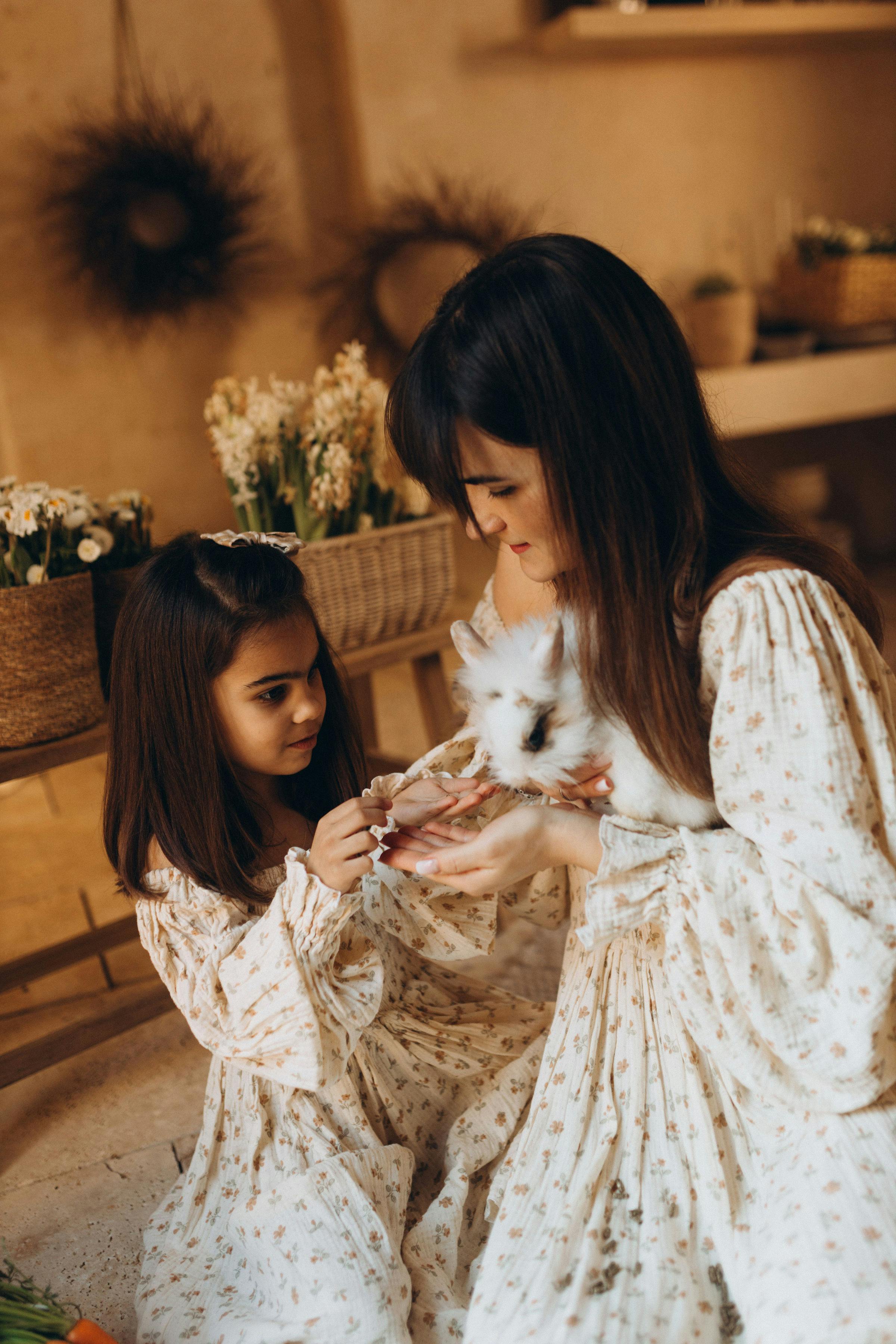 Mother and Daughter With Pet Rabbit